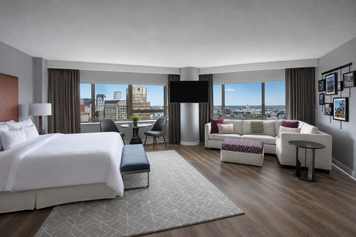 Hotel suite with Eaton sectional sofa, ottoman and bench